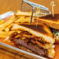 Cowboy Burger · 80/20 beef, sliced pickle, Tabacco onions, cheddar cheese, sweet BBQ sauce, lettuce, tomato,...