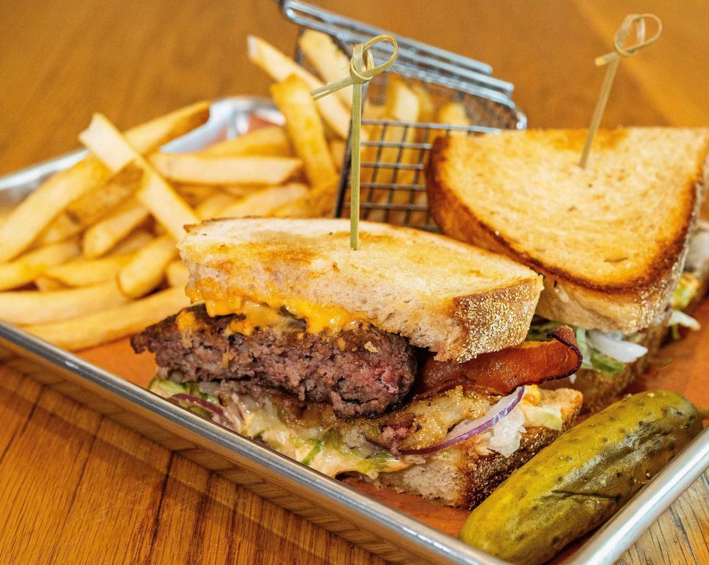 Southerner Burger · 80/20 beef, house-made pimento cheese, bacon, lettuce, onion, fried green tomato, toasted sourdough bread.