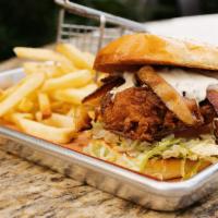 Fried Chicken Sandwich · Fried chicken thigh, provolone cheese, bacon, lettuce, tomato, onion, ranch dressing, toaste...