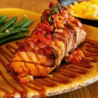 Bacon-Wrapped Salmon · Applewood smoked bacon, strawberry pico, citrus BBQ sauce. Choice of two sides. 