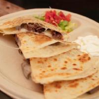 Asada/Beef Quesadilla · Beef . Flour tortilla with melted Oaxaca cheese. Side of tomatoes, sour cream, and lettuce 