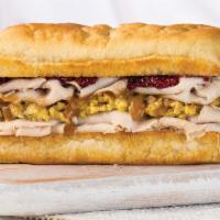 Holiday Turkey Sandwich · Turkey, cornbread stuffing, turkey gravy, cranberry sauce, and mayonnaise.