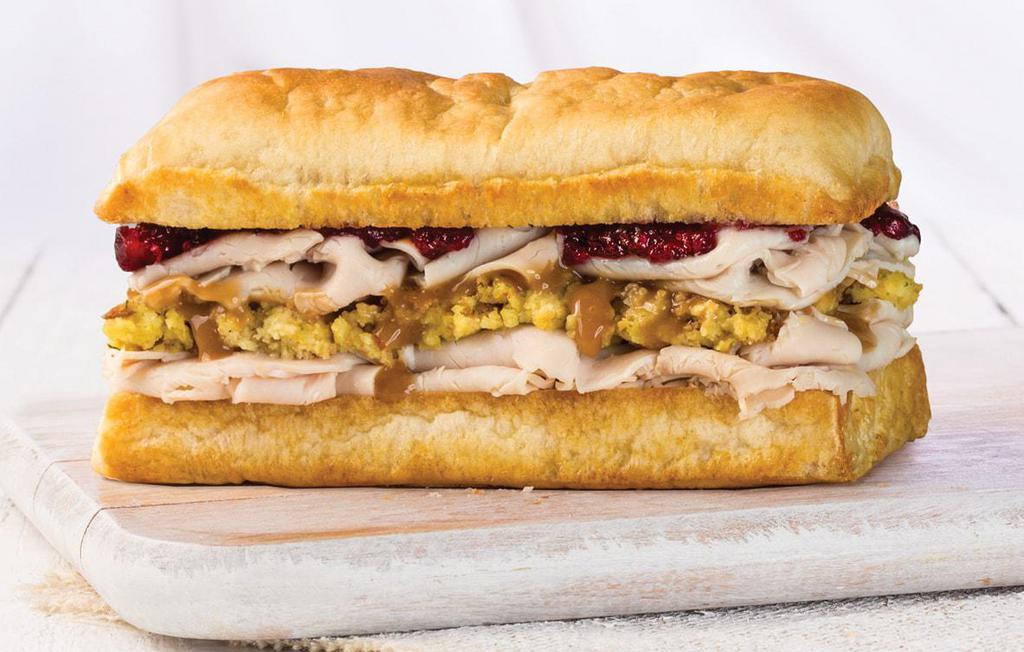 Holiday Turkey Sandwich · Turkey, cornbread stuffing, turkey gravy, cranberry sauce, and mayonnaise.