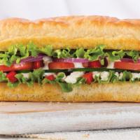 Veggie Sandwich · Feta, cucumber, red peppers, red onions, lettuce, roma tomato, and creamy Mediterranean dres...
