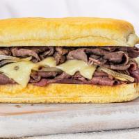 French Dip Sandwich · Roasted beef, Swiss, and sauteed onions, served with au jus.