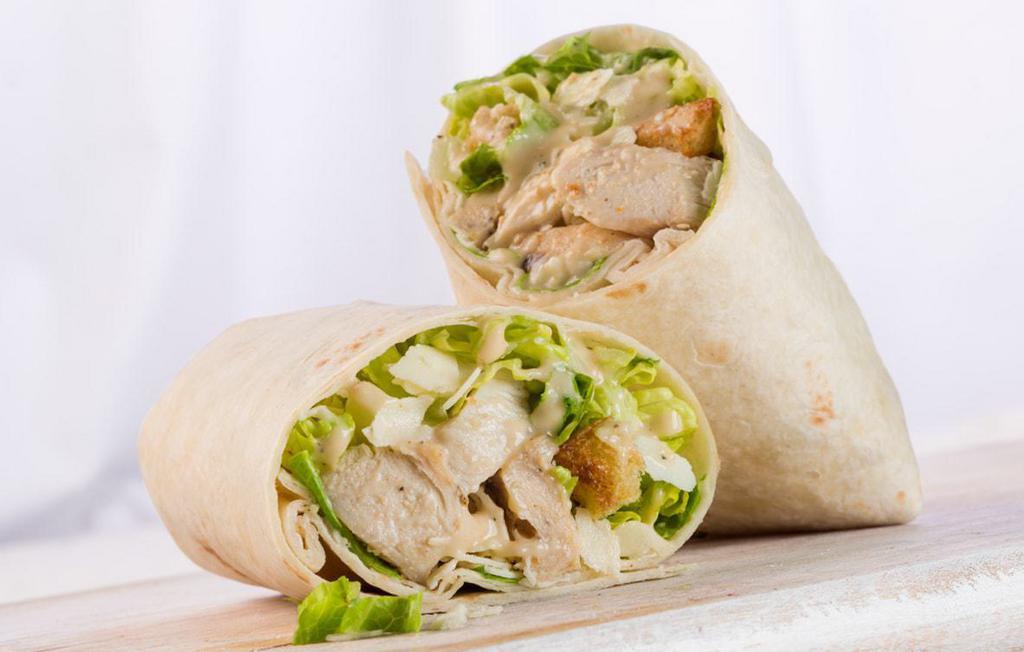 Chicken Caesar Wrap · Grilled chicken, shaved Parmesan, romaine, house-made croutons, and Caesar dressing.