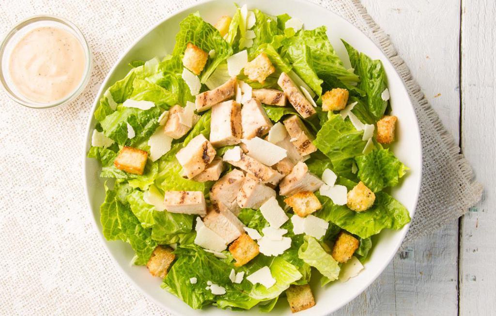 Caesar Salad · Chopped romaine lettuce with grated Parmesan cheese, croutons and Caesar dressing. Add grilled or crispy chicken for an additional charge.