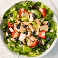 Berry Chicken Almond Salad · Spinach, spring lettuce, grilled chicken, fresh strawberries, fresh blueberries, almonds, an...