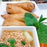 A3. Shrimp In A Blanket  · 4 pieces. Deep-fried jumbo shrimp and chicken wrapped in a spring roll skin. Served with swe...