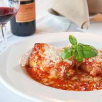 Eggplant Rollatini  · Eggplant stuffed with ricotta and spinach, baked in our plum tomato sauce and topped with mo...