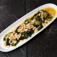 Escarole and Beans  · Escarole and cannellini beans sauteed with garlic and extra virgin olive oil.