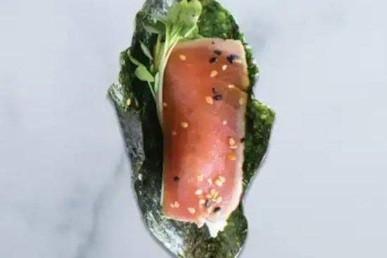 Seared Ahi Sushi Taco · sesame-crusted yellowfin tuna, avocado, wasabi aioli, soy-wasabi vinaigrette, daikon sprouts
