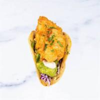 Traditional Baja Taco a la carte · crispy Alaskan cod, cabbage, cilantro, avocado-tomatillo salsa, jalapeño tartar