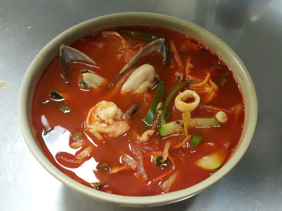N11. Spicy Seafood Udon Champon Noodle Soup · Seafood udon cooked with hot chili sauce.