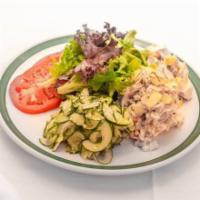 Chicken Salad Platter · Scoop of chicken salad, potato, and cucumber salads served with sliced tomatoes, mixed field...