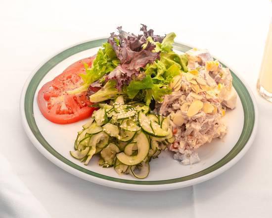 Chicken Salad Platter · Scoop of chicken salad, potato, and cucumber salads served with sliced tomatoes, mixed field greens, and vinaigrette.

