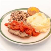 Meatloaf with Creole Sauce  · Meatloaf with creole sauce on the side, blue plate served with 2 sides and a corn muffin.
