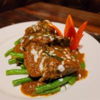 Short Ribs Chu Chee  (Spicy) · Braised Beef short Ribs, String bean, Kaffir lime leaves with special house made Chili paste...