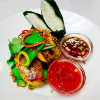 Gai Yang · Grilled, marinated and de-boned Cornish hen and steamed assorted vegetables served with coco...