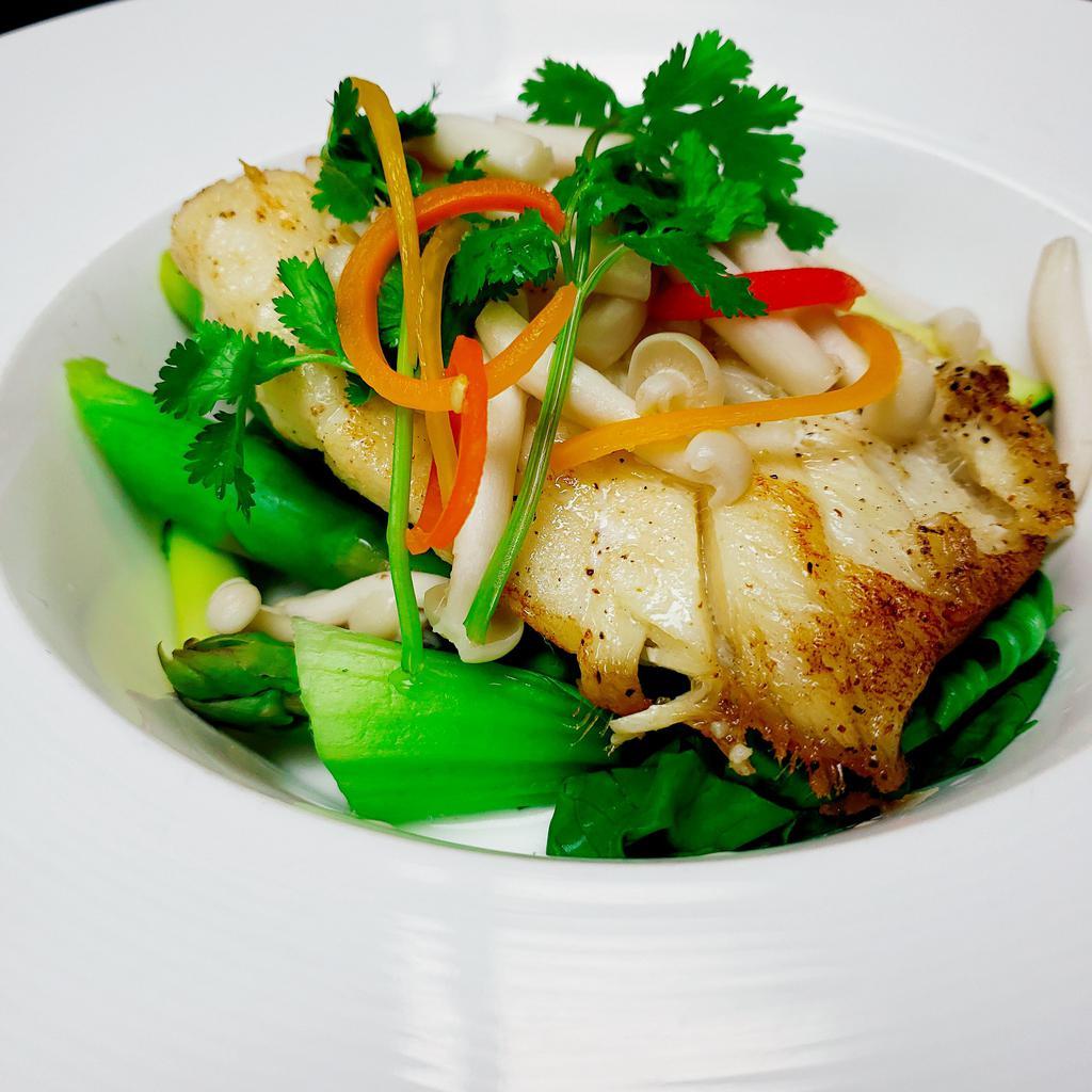 Chilean Sea Bass in Aromatic Coconut Milk · Pan roasted Chilean sea bass, bunashimeji mushrooms and asparagus, served in coconut bisque. Spicy. Gluten free.