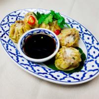 Kha Nom Jeeb · Steamed dumplings. Ground pork, shrimp, crab meat, Jicama and shiitake mushrooms and served ...
