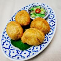 Curry Puffs · Minced chicken, potatoes and onions cooked with curry powder and served with sweet cucumber ...