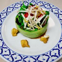 Thai Salad · Heart of romaine lettuce, beansprouts, cucumber, fried tofu, cherry tomatoes, served with pe...