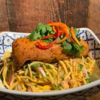 Grilled Salmon Mango Salad · Shredded mango, peanuts, coconut flakes, red onion and cilantro with Thai chili-lime dressin...