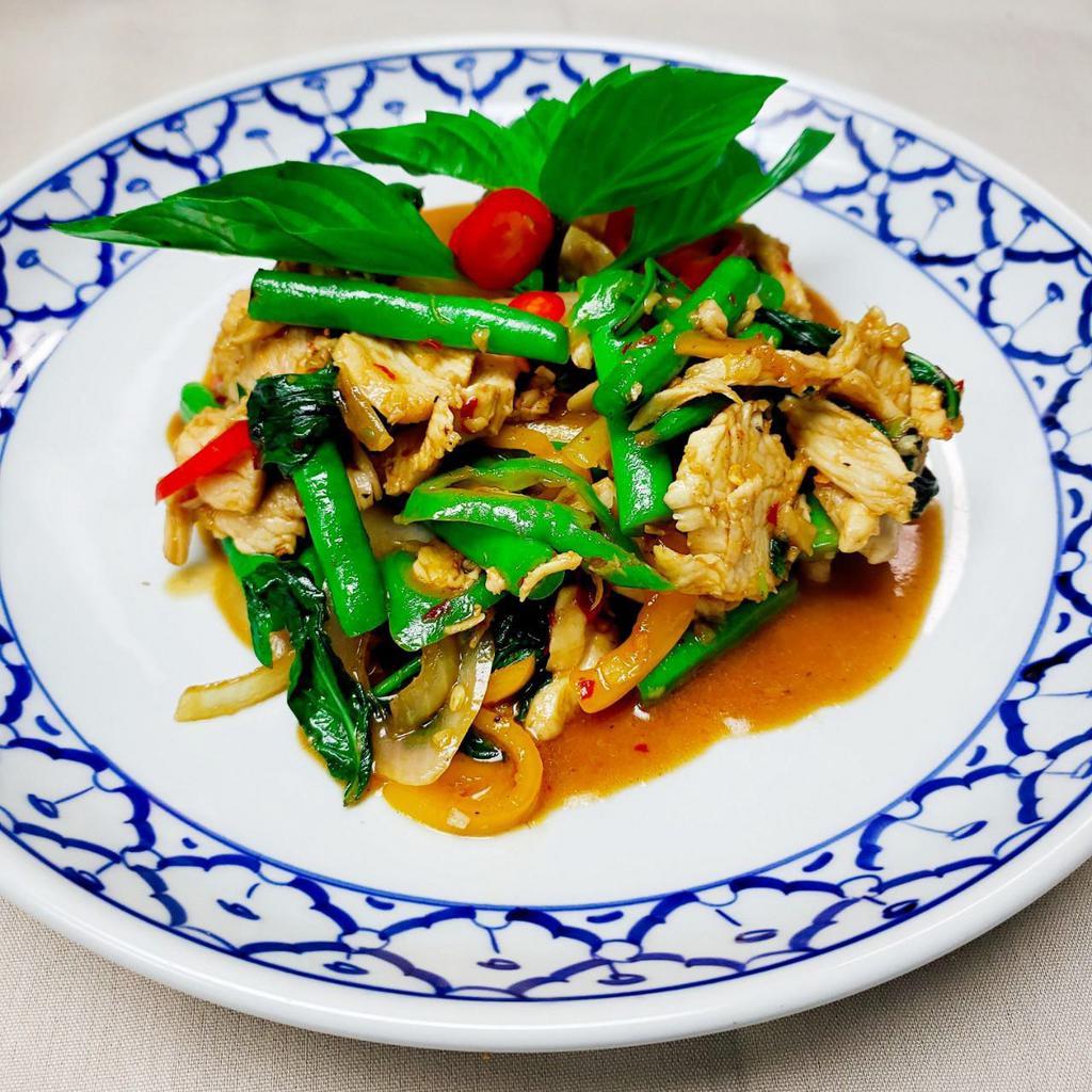 Pad Krapraw · Basil. Thai chili, string beans, onion, long hot pepper and basil leaves. Served with jasmine rice. Spicy.
