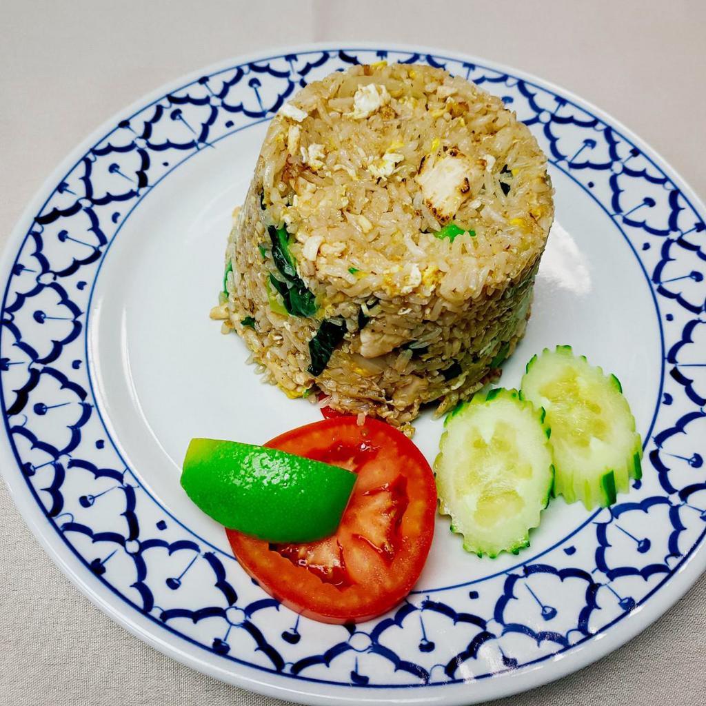 Thai Fried Rice · Chinese broccoli, onion, scallions, tomatoes and fried egg mixed with rice.