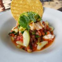 Ceviche · Fresh shrimp cooked in lime juice with cucumbers, onions and cilantro with tostadas topped w...