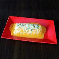 Burrito Suizo · Covered in suizo sauce and melted cheese.