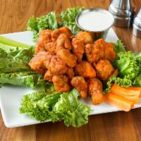 Buffalo Chicken Blasts · Housemade natural free range chicken bites, spiced and fried. Served with celery, Buffalo sa...
