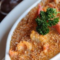 Seafood Casserole · Sea scallops, shrimp and lobster meat sauteed with sherry wine and garlic in a lobster cream...