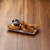 Classic Chicken Tenders · Breaded chicken tenders. Served your choice honey mustard or BBQ sauce.