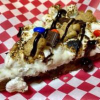 S'mores Cookie Slice · Chocolate chip cookie base, topped with vanilla buttercream, toasted with marshmallows, tedd...