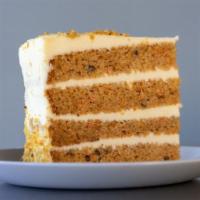 Carrot Cake Slice · Our classic carrot cake contains chunks of pineapple, chopped walnuts, coconut shavings, and...