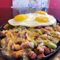 Western Skillet · Ham, green peppers and onions with shredded cheese.