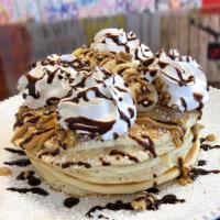 Monkey Business · Peanut butter griddlecakes, whipped cream, bananas, walnuts and chocolate drizzle.