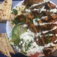 23. Dinner Special · Chicken or lamb and beef with rice, feta cheese salad, hummus or baba ghanoush and 1 pita.