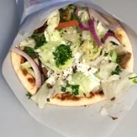 9. Gyro Lamb and Beef Sandwich · Sliced meat from the cone, lettuce, tomatoes, onions and tzatziki on pita.