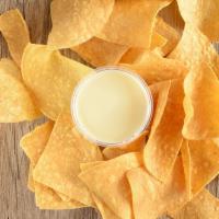 Chips and Queso · Corn tortilla chips with side of queso blanco.