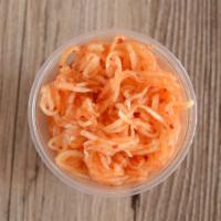 Kimchi Slaw · Our version of cole slaw, vinegar based with subtle heat.