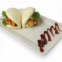 Bun Sliders (2 pieces) · Steam buns served with house sauce and topped with cilantro, cucumber, pickled carrots and j...