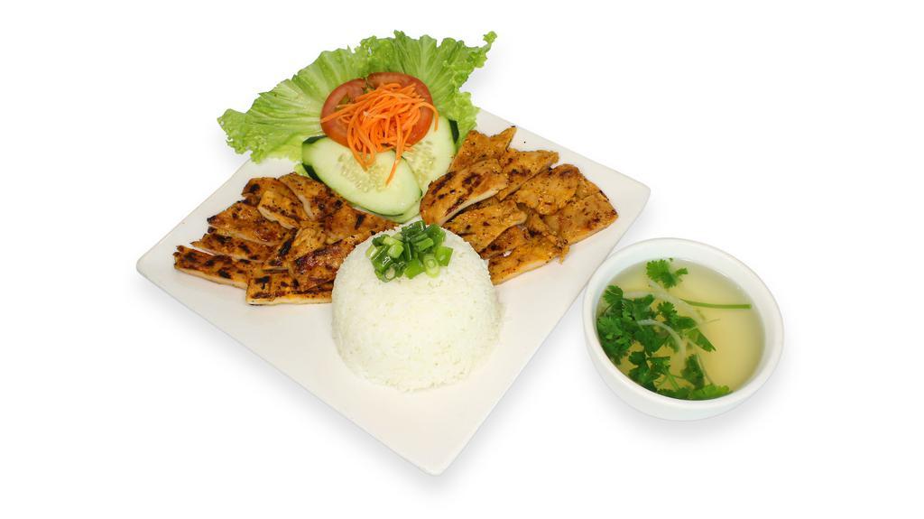 Rice with Charbroiled Chicken · Steamed jasmine rice served with charbroiled chicken; served with cucumber, tomato and house fish sauce; cup of pork broth served on the side