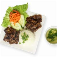 Rice with Charbroiled Beef · Steamed jasmine rice served with charbroiled beef; served with cucumber, tomato and house fi...