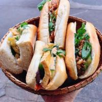 Grilled pork sandwich · Vietnamese style sandwich served with cucumber, daikon, carrot and cilantro with special hou...
