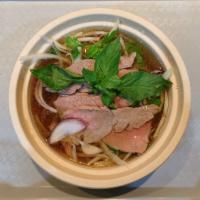 Pho Beef Bowl · Thin sliced raw beef with beef broth and rice noodles.Topped with scallion, cilantro ,onion ...