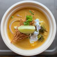Khao Soi Chicken Bowl · Chiang Mai curry with egg noodle, onion, scallion, pickled cabbage and cilantro. Spicy. Glut...