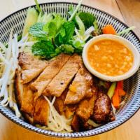 Grilled Marinated Pork Loin (bu'n) · with Organic SpringMix salad, daikon, carrots,mint leaves,cucumber,beansprout,scallion,roast...